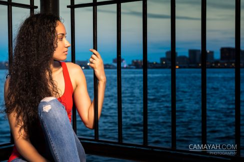 portrait-photography-model-looking-away-into-ocean-iris-tavarez